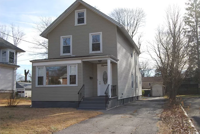 A 3 Bedrrom Colonial With 2 Baths, Living Room, Dining Room, Eat In Kitchen, Mud Room, 1 Car Garage, And Large Property.