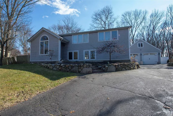 Custom Expanded Home Boasts High Wood Beam Ceilings W/Angle Arched Windows & Double Doors Allowing Natural Light Into The Lg Open Living Space W/Stone Fireplace; Main Spa-Like Bath W/Jetted Tub & Sep. Shower Stall; Enchanting Outdoor Living Space W/Lg Pergola Is Anchored By Newer Paver Patio; Private Yard Backs Wooded Preserve-Bike/Walk Greenway Trail To Pt Jeff.; Rad. Floor Heat In Kit. & Family Rm; Newer 200Amp Elec/Cac/Roof; Large Det. Garage W/Sep. Electric Sub Panel. Three Village Schools!!