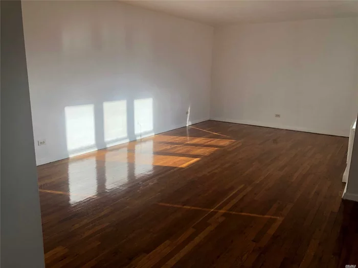 New Fresh Paint And Hardwood Floor, Sunny Bright 1200Sqft, Minutes To #7 Subway Main St Station And Lirr, One Block Away From Supermarket, Convenient To All.