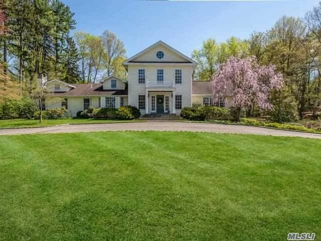 Completely Renovated And Expanded In 2002 This Colonial Boasts 5 Bedrooms And 4.5 Baths. This Charming Residence Is Situated On 2+ Acres In Lattingtown Harbor With 1st Floor Master Suite, Full Bath & Sitting Rm W/Fireplace, 28&rsquo; Ceilings In Great Rm & Entr. Lg Eik, Great Room, Formal Dining & Potential In-Law Suite. Lower Level Has Radiant Heat. Wine Rm, Mudrm And Attached 3 Car Garage. Speakers Thruout The Entertainment Rooms. Our Own Beach And Beach House! Hamptons Style Living!