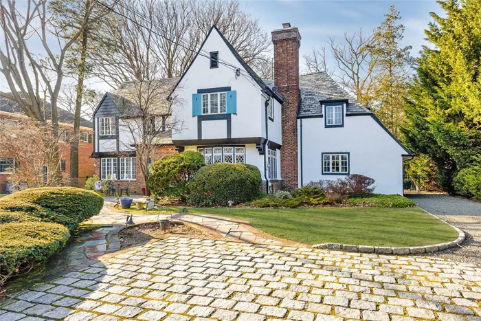 Elegant Shakespearean Style Center Hall Colonial Tudor In Harvard Section. Boasts Old World Charm Architecture Including Slate Roof, Front & Rear Staircases, And Stained Glass Windows. First Flr Features Gracious Lr W/Fireplace, Fdr, Family Rm W/Fireplace, Kitchen W/Breakfast Rm And Separate Meal Prep Area, And Half-Bath. Upstairs Offers Master Ensuite With Access Another Br, Plus 3 Add&rsquo;l Br F-Bath Plus Guest Ensuite W/Rear Staircase And Access To Another Br. Spacious Private Backyard. 200Amp