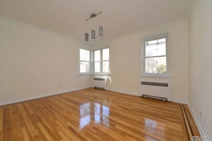 Fully Renovated Corner, Spacious Apartment With 2 Over Sized Bedrooms. Prime Location.Corner Sunny Apartment Features A Bright Living Room, New Bathrooms, Large Bedrooms, New Windows, Ample Closet Space And Beautiful Hardwood Floors Throughout. Immediate Parking Is Available For An Additional Fee. Just Steps Away From Train Station, Shopping And Schools.
