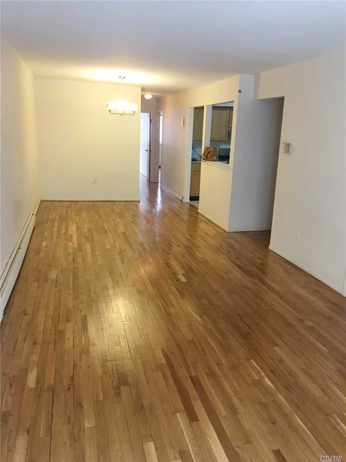 Beautifully Renovated Apartment Located In Hearts Of Flushing With Over 1200 Sqft Of Living Space. Features 3 Large Bedrooms With Huge closets. Spacious Living Room With Sliding Door to The Balcony. 1.5 Bathroom. 1 Parking Spot Included. Brand New Eat-in Kitchen, Hardwood Floor Throughout. Minutes to 7 Train, LIRR, Local Buses, Schools, Restaurants, Super Markets!!! A Must See. No Pets.