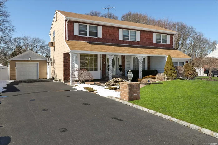 Spacious and wonderful 4 bed Center Hall Colonial set on .28 acre of pristine property. All hardwood floors throughout. Updated kitchen/some newer windows/tons of closet space/new doors throughout/Gas lines in font of house/PVC fence around entire property/travertine patio/ koi pond/Ideal location all within the famed Commack Blue Ribbon school district. Basic star is $1, 202.97.