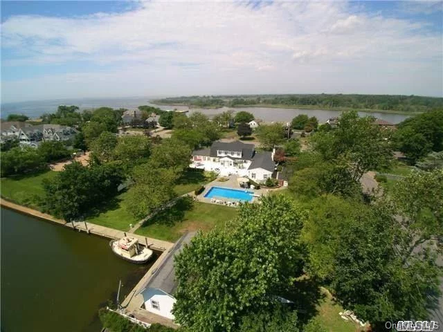 Waterfront, The Moorings Choice Location Chosen For Privacy! 1 Acre W/115&rsquo; Deep Water Dock! 4 Brm. 3.5 Bath 4000 Sqft. Center Hall Colonial, Multiple Large Living Areas. Possible First Floor Master!Some Updates Include Gorgeous New Kitchen, Bathrooms, Laundry Rm. Heated Boat House, 16 X 36 Ig.Pool. Association Tennis Courts, 24-Hr. Guarded Gatehouse.