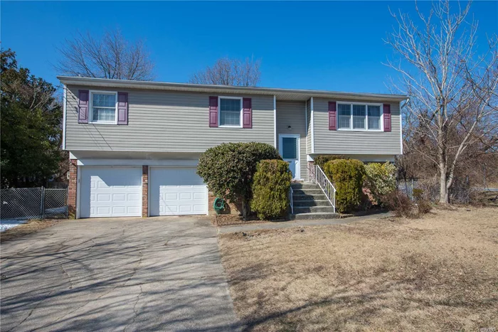 Wide line Hi-Ranch with plenty of room. Offers 5 Bedrooms & 2 full baths. Living room, dining room and den. Hardwood floors throughout, deck for entertaining and two car attached garage. Centrally located and convenient to transportation. West Islip schools.