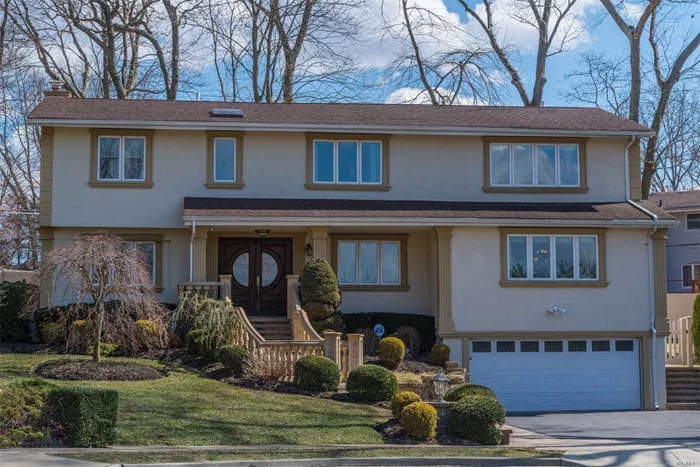 Better Than New! Redesigned & Expanded W/ The Finest Materials. This Five Bedroom Colonial Sits At The End Of A Cul De Sac.Chef&rsquo;s Granite Eat in Kitchen, Oversized Dining Room, Family Room With Custom Built Ins, Beautiful Hardwood Floors, Coffered Ceilings & Moldings. Two Master Suites Professionally Landscaped Yard W/ Patio & Fully Fenced Yard.Full House Filtration System.