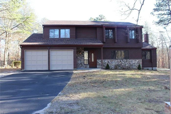 Beautifully Renovated 4 Bd/2.5 Bth Center Hall Colonial Home, Situated On Over 1.75 Acres Of Property. This Private Oasis Offers New Roof, Updated Kitchen W/Granite And Ss Appliances, Brand New Hardwood Floors, Updated Baths, Full Unfinished Basement, 2 Car Attached Garage, Updated 200 Amp Electric, Updated Heat. Nice Size Yard That Is Great For Entertaining. Must See!!