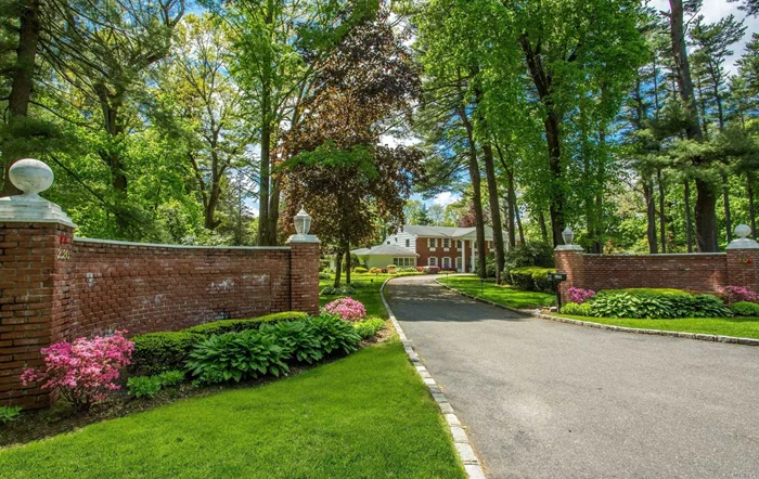 Gracious brick home sited on 2 magnificent acres in Old Westbury. Dbl story entry foyer opens to an oversized sunlit LR with white marble floors, banquet sized DR, LR with coffered ceiling, wood burning fireplace and French doors leading to the spectacular 2 acres. Other discerning features include a master STE with sitting room, designer fitted walk in closet, marble spa bath with 2 vanities, jacuzzi tub and separate shower. All rooms are generously sized.Possible 2nd master on main. Jericho SD