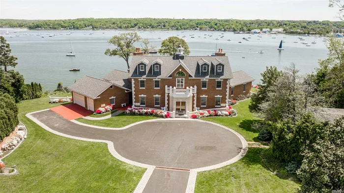 Centre Island, Stately Brick Colonial Style Manor Home, Perched On 3.26 Waterfront Acres w/ 250 feet of Sandy Beach .This Spectacular Property Features 180 Degree Panoramic Waterviews From Almost Every Room.The Spacious Interior Boasts, 10 Ft Ceilings, Radiant Heat, Marble Bathrooms, 5 Fireplaces, Custom Moldings & Architectural Details Throughout.The Home Also Includes A Separate 2 Car Gar & 800 Sq Ft Cottage W/Waterviews. Beautifully Landscaped Property Perfect For Entertaining W/Steps To Beach.