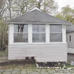 Spectacular Views overlooking Port Jefferson Harbor! Wonderful waterfront cottage. A Piece of paradise!. Hidden Treasure in Poquott Village. Community Tennis courts, Private Beaches Community dock.