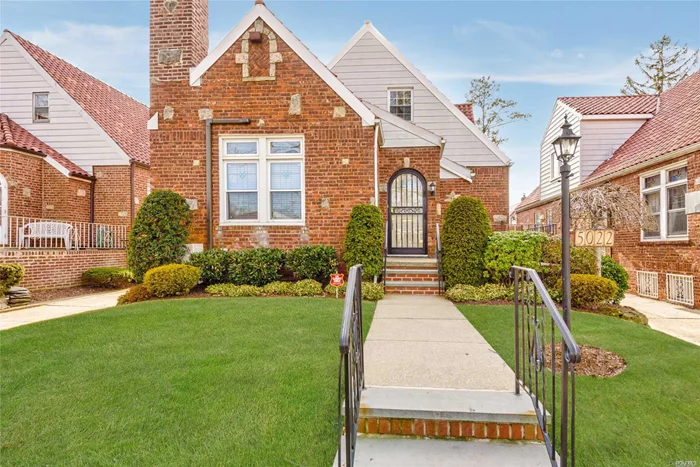 Rare brick tudor cape w/ charming details. Vaulted ceilings & wood beams in the living room w/ fireplace. Large formal diningroom. Kitchen is spacious with stainless steel appliances. Updated full BTH with two vanities. MBR is on the 1st flr. along with second BR. Up the stairs there are 3 BRs and one full BTH. Attic provides plenty of storage. The basement is expansive w/ OSE and Washer/Dryer. Pvt driveway with 1.5 garage & mature landscaping. District 26. Transportation close by.