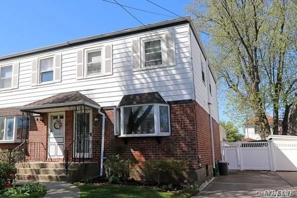 Beautiful Semi-Detached home Conveniently located in the heart of Bayside, 28X120 Lot in the middle of the Block, Features 3Bed 1Bath, Formal Dining Rm w/Open New Kitchen, Door to Large Back Yard with All fencing for privacy, Hard Wood Fl, Finished Basement, Close to Northern Blvd, LIRR, Bus, Schools, Restaurants, Shopping..A Must See-Wont Last