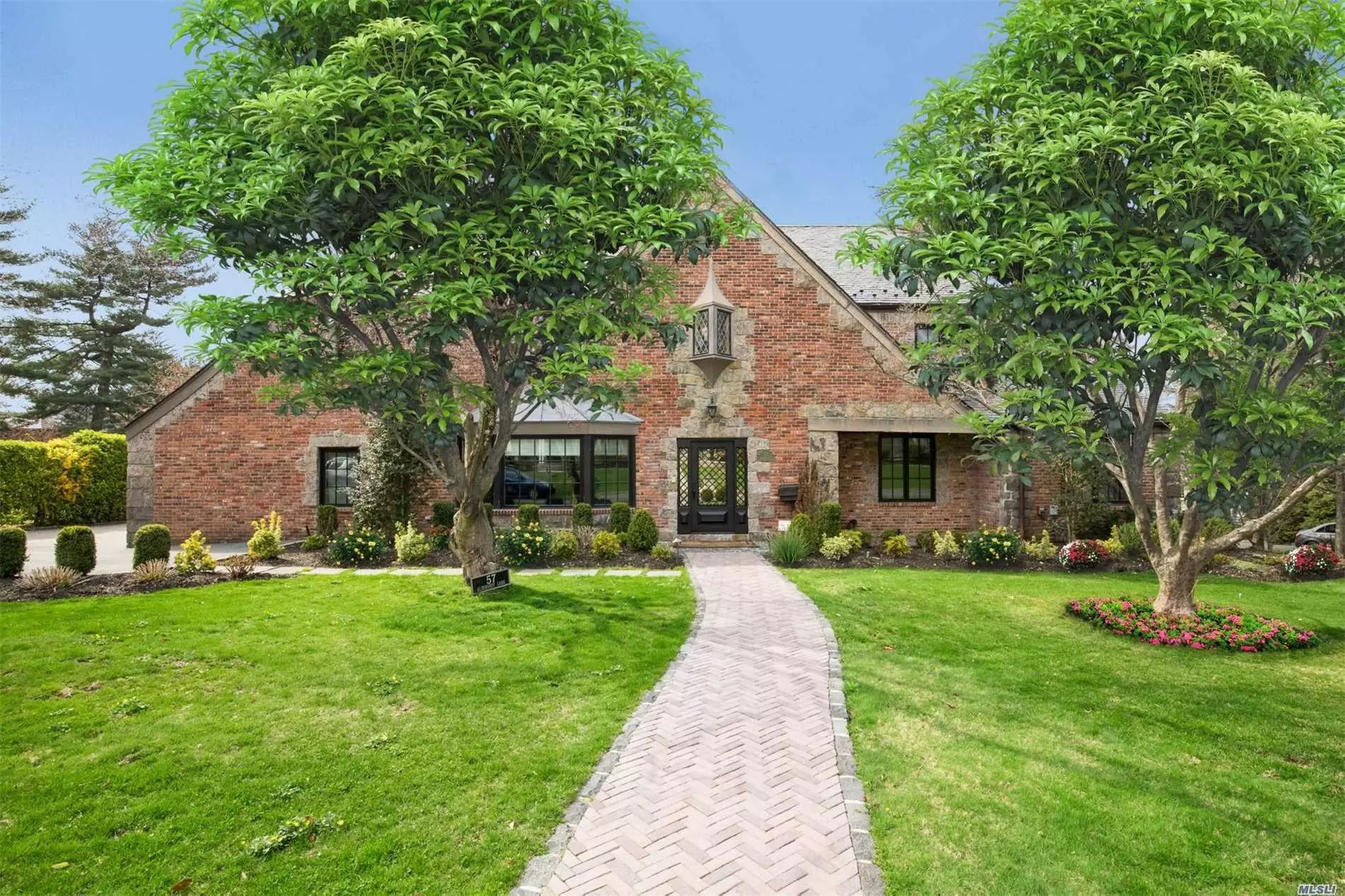 Beautiful Renovated Brick & Stone Colonial in Strathmore Village. This Spectacular Home Features 5 Bedroom, 5.5 Bath. Formal Living Room w/Fplc; Elegant Dining Rm; Chef&rsquo;s Eat-in-Kitchen; all Upscale Appliances, Marble/Travertine Counter Tops and Family Rm Combo w/Gas Fireplace. 14 Zone Radiant Heated Flrs throughout; Master Suite w/Luxurious Bath and Balcony. Fin Basement w/Media Room w/Sub-Zero Ref, 1/2 Bath and Gym. 2-Car Garage/Paver Stone. Driveway. Munsey Park Elementary. Taxes Grieved.