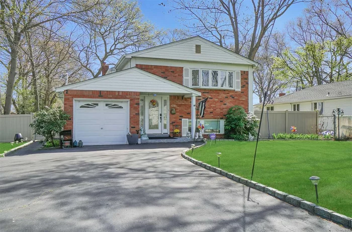 Impeccably maintained Hi-ranch in Saxon Park section of Bay Shore / Islip SD. Possible Mother/Daughter (w/proper permits); Main floor boasts open style Living and dining, EIK, 3 bedrooms, 1 bath and great deck for outdoor entertaining. Lower level mirrors main floor with additional kitchen, LR/DA, 3 bedrooms, 1 bath and separate entrance. 1-car attached garage. Beautifully landscaped. New roof! This is a must-see.