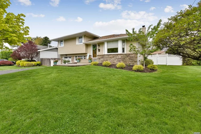 Perfect mid block location! Updated 3brs, 2.5 bath split level home! Wonderful curb appeal w/wide driveway & stone entry walkway. Gleaming oak floors, Lr w/L-shaped Dining Room, open to Eik w/Anderson windows, sliders to trex deck & stone patio. Den level w/1/2Bath, Garage Entry and Dr to Patio.Basement finished like living space! Playroom/Office.Cac, redone roof & windows, professional landscaping, PVC fencing. Syosset SD#2-Robbins Lane, Thompson, Syosset HS. Low taxes $15, 683 and being greived!