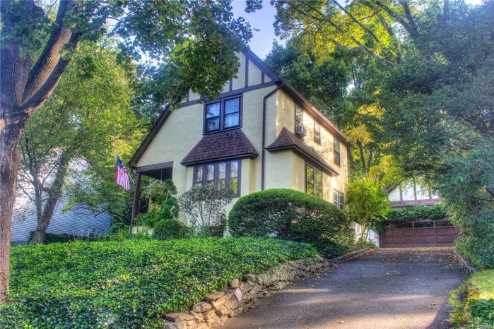 This enchanting tudor with storybook charm sits perched on the hills of Manhasset Bay Estates. Great mid-block location. Spacious eat-in kitchen, formal dining space and living room on 1st floor with three bedrooms on 2nd floor. Every room blanketed with sunlight from morning to sundown. Outside, a gardener&rsquo;s dream awaits with a variety of flowers and mature plantings, a front-porch and detached two-car garage. Large attic and full basement. Beach, dock and mooring with required annual fees.