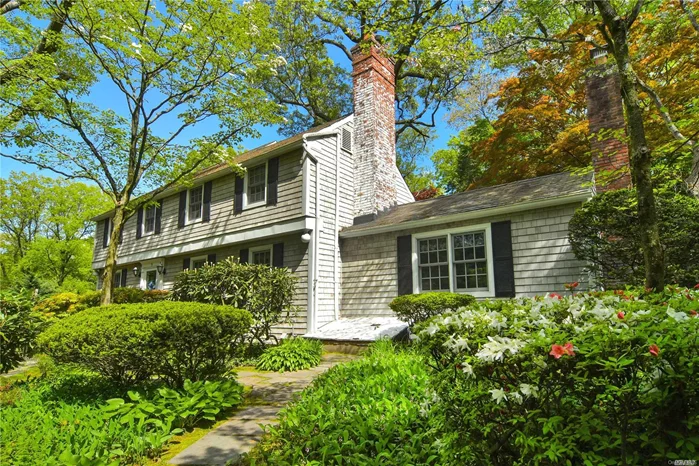 Surrounded by beautiful gardens on .44 acres, this classic 3 bdrm, 2.5 bath Beacon Hill Colonial is your own private sanctuary. Main floor offers a large-scaled living room & den, each w/fplc, and perfect as gathering spaces. A sun-filled room adjoining the eat-in kitchen is ideal as an office w/perfect view of the lush gardens. Upstairs are the master bedroom suite with dressing room, plus two large bdrms and a full bath. Lower level w/mudroom, laundry, storage. Beach and tennis w/dues.