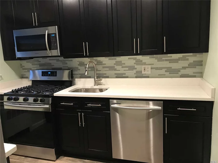 2 Bedroom Lower Garden Beauty Featuring Renovated Bath With Porcelain Tile, Fully Renovated Kitchen With Stainless Steel Appliances And Granite Counter Tops, Beautiful Hardwood Floors, Corner Unit with Additional Windows,  Pets Ok! Private Entrance, Close To Shops and Transportation, Can Sublet After 2 Years