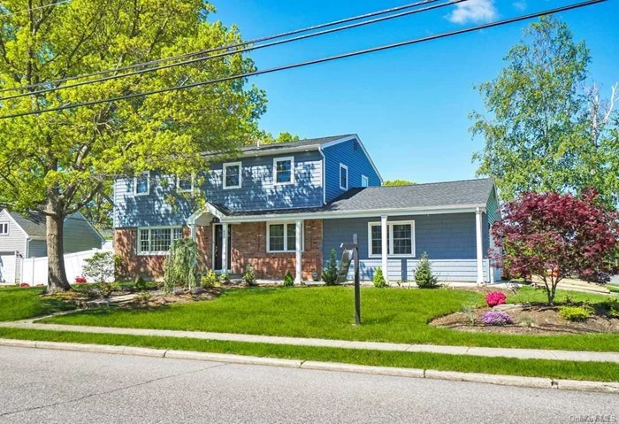 Beautiful totally renovated colonial situated in Holbrook. This home boast an open floor plan, beautiful wood floors with 4 bedroom, 2 1/2 baths, spacious quartz center isle kitchen, stainless steel appliances , gas cooking, spacious formal dining room, formal living room, family room with fireplace and walk out to the sunroom. Full basement. This home is great for entertaining! Sachem schools, close to shopping and parkways.