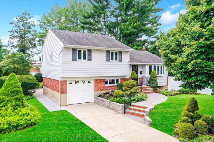 Move In Ready! Beautiful Renovated Split with High End Stainless Steel Appliances, Vaulted Ceiling, Huge Center Island, Open Concept Layout, Hardwood Floors, Stacked Stone Electric Fireplace, New CAC, New Boiler, Outside Entrance, Huge Patio, Large Backyard