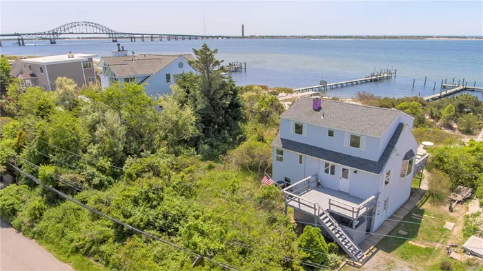 Welcome to the Beach! Prime Location on Fire Island Inlet secluded behind the gates of Oak Beach Association. Launch your water toys right behind the house and keep your boat at the dock! A thoroughly updated home with unbeatable views on over a half acre of sand, ready for year round or seasonal beach fun!