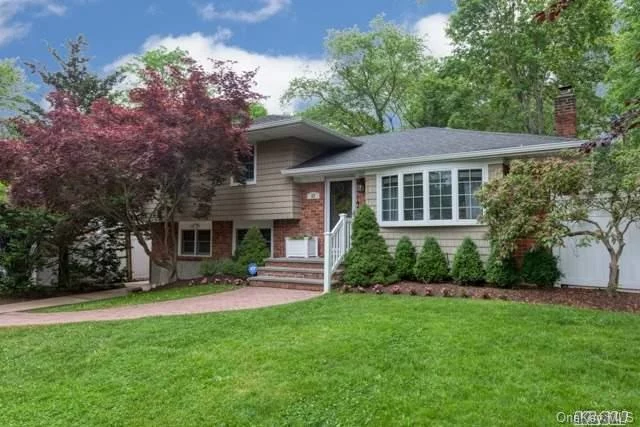 Beautifully updated split on a Cut-de-sac in East Northport. Newer kitchen, bathrooms, CAC, 200 amp service, Anderson windows, water heater and redone deck. Young roof and boiler. The garage has been converted to an additional den and laundry room/pantry. The basement is also finished - so there is plenty of space for everyone. Nothing left to do but move in and unpack. Hurry to this one!