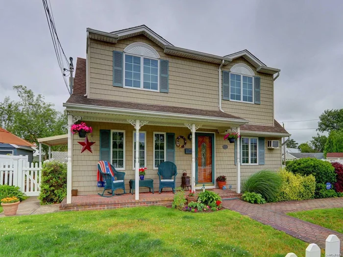 Move right into this charming expanded cape. Beautifully manicured yard, front porch and picket fence. Inside features an extended sunken Den/Living room with skylight, two slim line A/C units and four bedrooms. Located in the Plainedge School District. Won&rsquo;t Last!!!