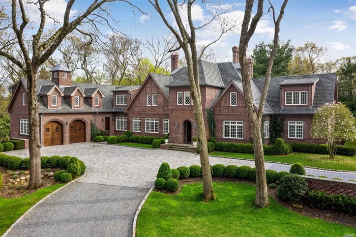 Absolutely stunning and unique 7500 sq ft stately brick tudor-style home on 2 lush, private acres with 1, 000 sq ft Studio Pool House w Fp, Kit, Bth and Radiant Heat. Saltwater Pool, Koi Pond, 5 bedrooms, 5 Full and 3 Half-Baths. Completed 9 years ago with no expense spared and attention to every detail. Separate Driveway accesses lower level of completely finished space with 11 foot ceilings and room to display 14 cars, Gym, Bonus Room, Br. Generator.Choice of Jericho or Syosset Schools.Cover of Dupont.