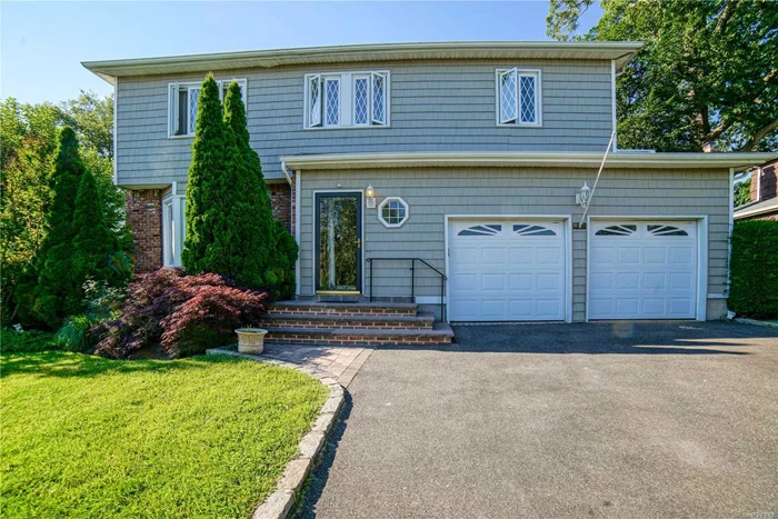 Located in a tranquil cul-de-sac, this large scaled home offers fabulous amenities, gourmet eat-in-kitchen, family room leading to a deck and private serene backyard, perfect for entertaining. This is not to be missed!!