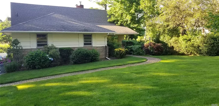 Sunny and spacious expanded ranch home. Convenient to LIRR, bus, shopping, parks and town. Sunny eat-in kitchen with door to deck area that overlook the back yard. Huge basement perfect for entertainment and access to the garage. Newly paved driveway.