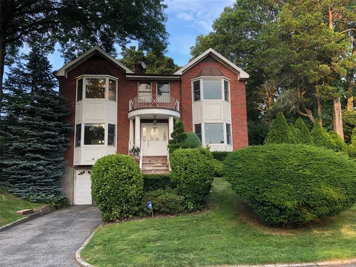 Lovely Renovated Brick Colonial. 5 Bedrooms, 3 Full, 1 Half Bath. Updated Eat-in-Kitchen, Formal Dining Room w/Fireplace, Living Room w/Fireplace. Partially Finished Basement. Hardwood Floors Throughout. Close Proximity to Town and LIRR.