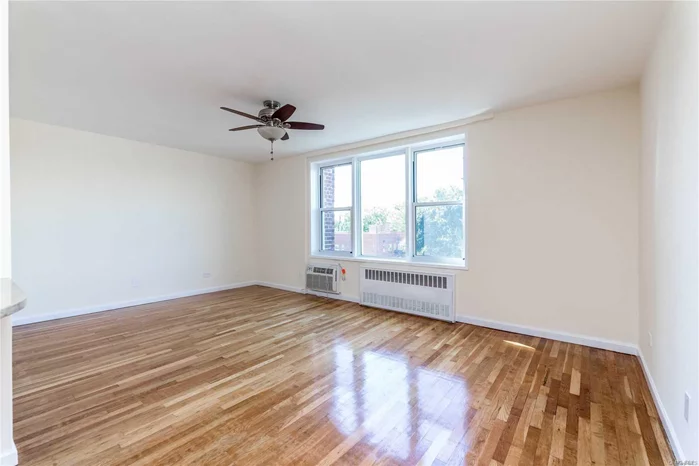 Stunning 1BR Coop For Sale! Shows like Brand New Featuring Redone Flooring, Recently Painted, Updated Kitchen With Stainless Steel Appliances. Close to LIRR And Bell Blvd.