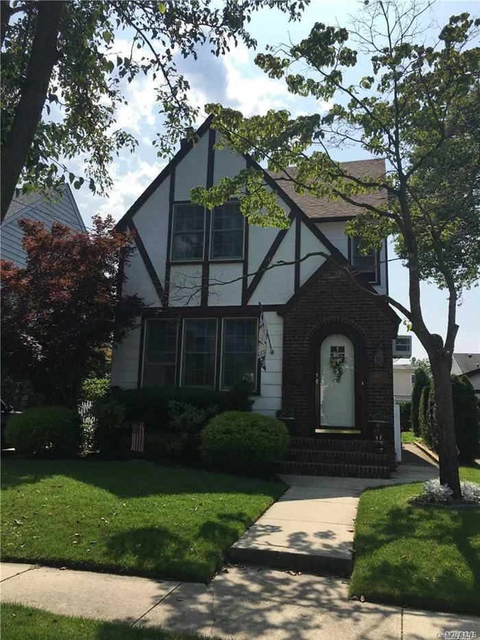 Beautiful updated and exceptionally maintained Tudor Colonial.