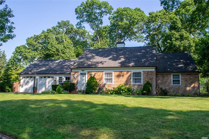Cedar Shingled Cape at end of cul de sac. This home features Living room with fireplace, Formal Dining Room with french doors to a slate patio,  Gourmet Kitchen, 2 bedrooms, bath, enclosed breezeway, 4 Car Garage, & full basement. This home can be easily expanded.