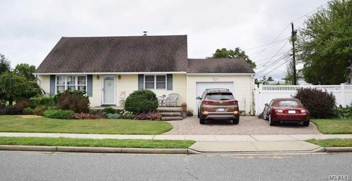 Just Unpack The Bags And Move Right Into This Rear Dormered Cape ! This Home Comes With A Cabinet Lined Kitchen With Granite Counters, Gas Cooking, Parquet Flooring, 2 Fully Updated Bathrooms - Upstairs With Jacuzzi Tub, Replaced Windows, Oil/Gas Heating, Central Air, Fully Fenced Property With PVC. Front & Back Inground Sprinklers, All Nice Sized Rooms, Hardwood Floors On 1st Floor & Laminate Floors On 2nd Floor, Super Curb Appeal, Tons Of Basement Storage Along With An Oversized Garage.