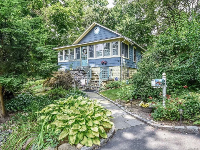 Nestled on the hillside, this 1920&rsquo;s bungalow is loaded with charm and convenience. All new and updated, with garage, deck, arboretum-like grounds and an outside lower level entrance. And, there is so much more to see!