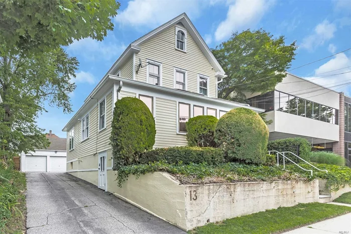 Directly across from LIRR, incredible visibility & locations, mixed use building, alarm, newly painted iside & out, fire retardant, 2 garages, plus 4/5 parking spots for extra income.