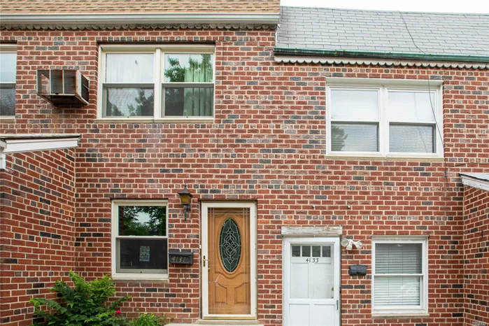 Commuters delight! Ideal solid brick legal two family attached town home blocks to  Bayside village Bell blvd LIRR, culturally enriched dining and entertainment, shopping, Northern Blvd and major highways. This home offers a renovated two bedroom apartment with updated cabinetry and stainless steel appliances, Washer dryer and private balcony on the second level. First level apartment features an eat in kitchen, spacious living room facing rear patio, one bedroom and a full bath & garage