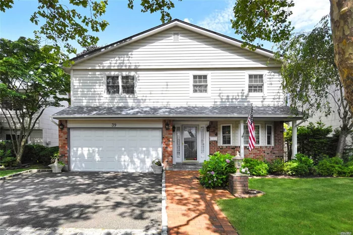 A One-Of-A-Kind Splanch. With an extended dining room; completely redesigned eat-in-kitchen repositioned to face the back of the house and featuring a brick fireplace and vaulted ceilings with skylights; and an open great room just above, this home was designed for easy and comfortable living. Four bedrooms share the upper level and include the master with walk-in closet and renovated bath with tub. Too many upgrades and extras to list. Great location. Lovely yard with beautiful patio and deck.