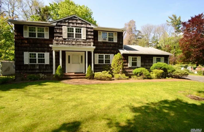 Classic Center Hall Colonial Nestled on Private Setting! Large Ef, Formal Lr, Fdr, Eik w/Mud Rm/W/D, Powder Rm, Den w/Wood Burning Custom Fireplace and French Doors to Stone Patio, Hardwood Floors Throughout. 2nd Floor; Master Bdrm Suite w/Full Bath, 3 Addl Bdrms & Hall Full Bath. 2 Car Attached Garage. 6 Car Driveway. In-ground Sprinklers. Wonderful Yard and Property. Award Winning North Shore Schools!