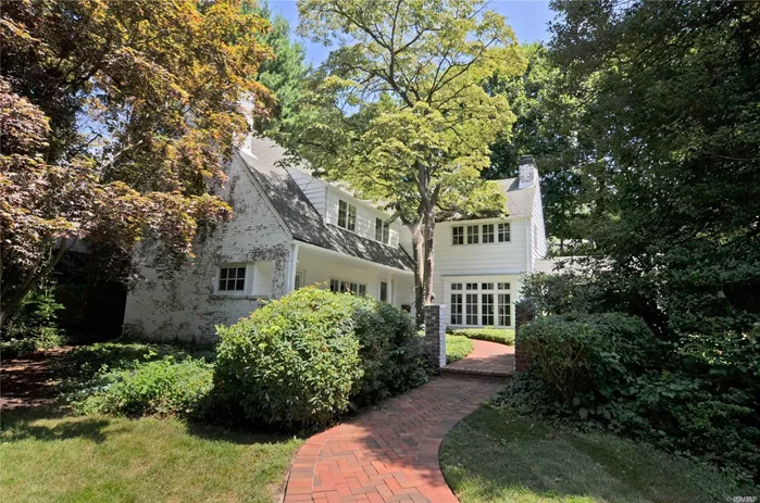 Classic architect designed English country house. Private 1/2 acre, w lovely landscaped property and front porch overlooking courtyard. Separate artist studio/office w 1/2 bath & fp. Custom features throughout w 4 fireplaces, beautiful window vistas, built-in shelving, window seats, cathedral ceilings and more. Beacon Hill Association beach on Hempstead Harbor w $175 dues.