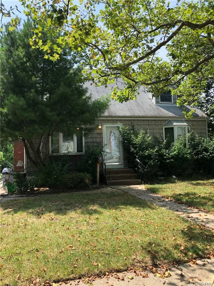 Oversized Cape House Conveniently Located In A Beautiful Tree Lined Street In Bethpage. This Cape Homes Comes With A Full Basement, Five Bedrooms, 2 Full Bathrooms, Open Kitchen, Dinning Room, Lots Of Sunlight Exposure With A wood Burning Fireplace. House Sits on a 60x120 Lot.