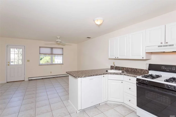 This sunlit unit offers a large eat in kitchen with doors to a balcony for outdoor spaace. Each bedroom has a bathroom and the lower level offers washer/dryer hook up and storage as well as access to the garage. Close to transportation, shopping and dining.