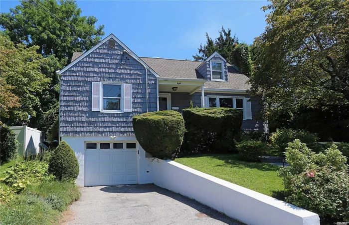 This spacious & charming 4-bedroom, 2.5-bath home offers flexibility w/classic Cape Cod floor plan. With 2 bedrooms on the 1st floor, one can be a den or dining room. The 2nd floor with full rear dormer provides a large Master BR w/ sitting area plus an office off another BR. Beautiful finished basement with tile floor, half bath, ample closet storage, laundry room & access to the 2-car tandem garage. Also enjoy CAC & lovely private property! Glen Cove schools, beaches, parks & golf. Low Taxes!