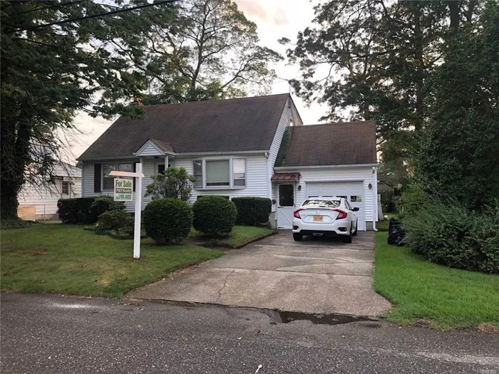 AVAILABLE TO SHOW!! Priced to Sell!! This half dormered Cape was well maintained by the original owner. Located close to the redeveloping Village of Lindenhurst and LIRR Station. Hardwood floors through out the house, great opportunity.