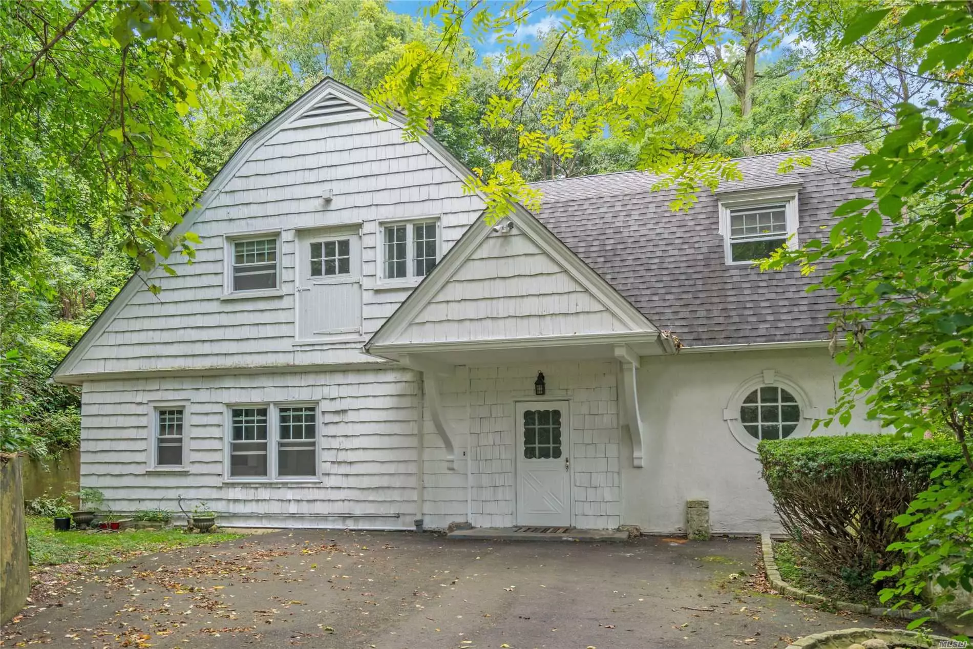Absolutely Charming Old Carriage House with Water Views Of Oyster Bay Harbor. Master Bedroom With Full Bath, 2 Bedrooms And A Bath. Living Room with Fireplace, Dining Room And Spacious Kitchen.