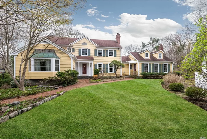 COLD SPRING HARBOR SD #2. Located one of the most picturesque streets and set on two park-like acres. This classic 5br Colonial presents a gracious floor plan for elegant living. The gourmet kitchen with large eating area opens to a comfortable den with fireplace. Large 1st floor Master bedroom suite, finished lower level. French doors across rear of house ope to brick patio & pool.