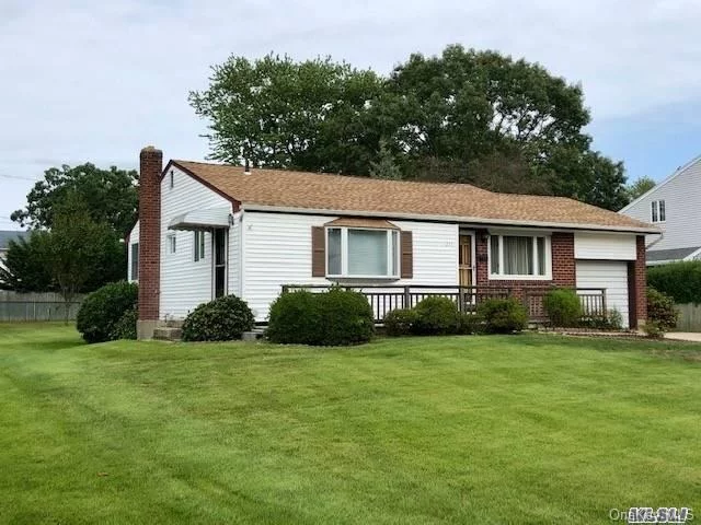 Lovely Ranch South of Montauk Hwy. Very well maintained. Seller converted 3rd bedroom into one very large room - easy conversion back. Very spacious eat in kitchen/dining combo. Partially finished basement/den w/heat & cac (with sep utility/laundry/storage room). Central A/C. Sliding doors to trex deck with electric awning and beautiful grounds. In ground sprinklers and double driveway. All this, located in a charming neighborhood on a street lined with antique lamp posts! Don&rsquo;t Miss It!!