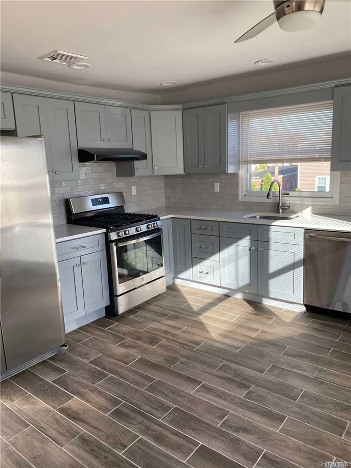 Gorgeous, Bright And Clean Second Floor Apartment Updated In 2-Family Home Features 3 Bedrooms And 2 Full Baths. Large Living Room And Dining Room With 2 Skylights, New Eat In Kitchen Also Includes Central Air Conditioning, Alarm System